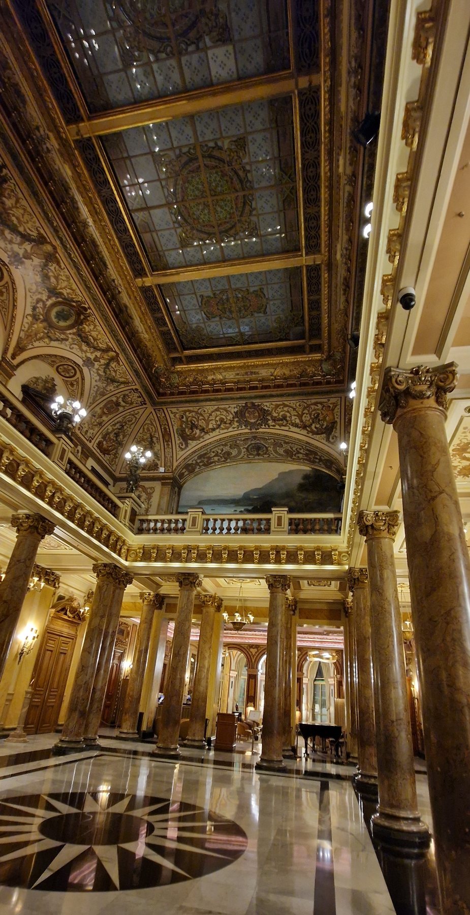 The gilded interior of the Monte Carlo Casino with its dome and columns